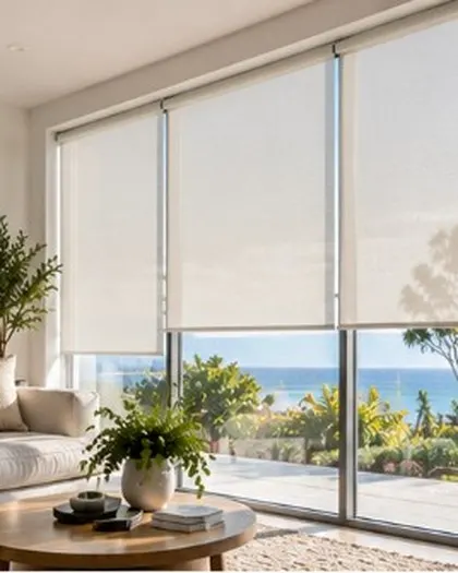 Sheer white roller blinds in a coastal living room