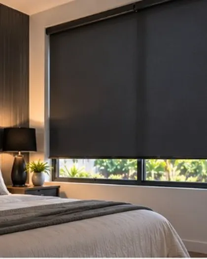 Charcoal roller blinds in a bedroom