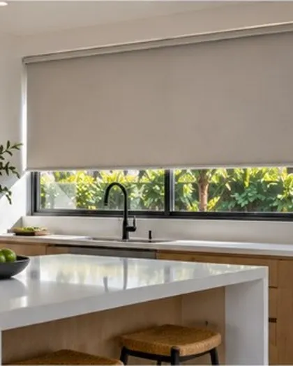 White roller blinds above a kitchen sink
