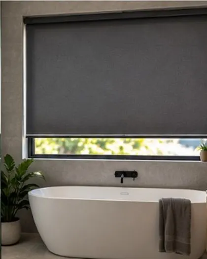 Charcoal roller blinds in a bathroom