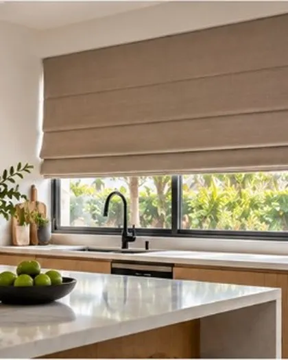 Beige Roman blinds above a kitchen sink