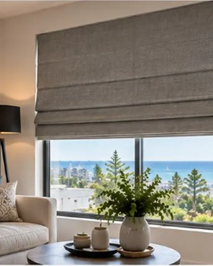 Grey Roman blinds in a living room with ocean views