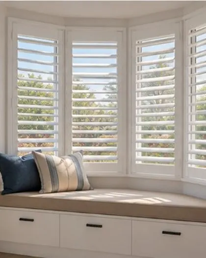 White plantation shutters on a bay window seat