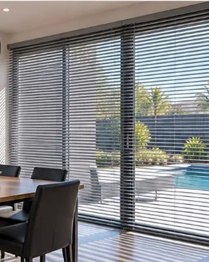 Charcoal Venetian blinds in a dining room